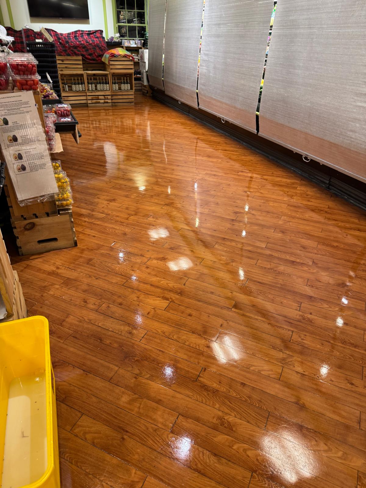 Retail store wood floor after stripping and waxing