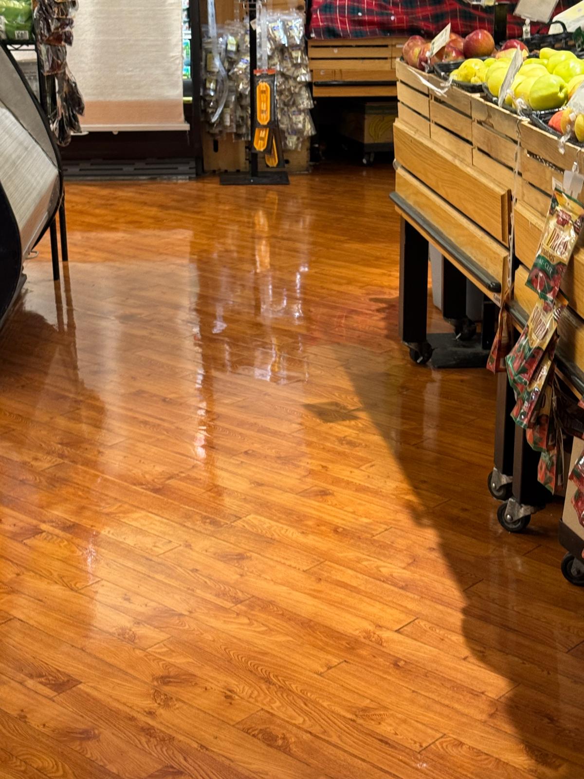 Grocery store produce section with waxed wood floor
