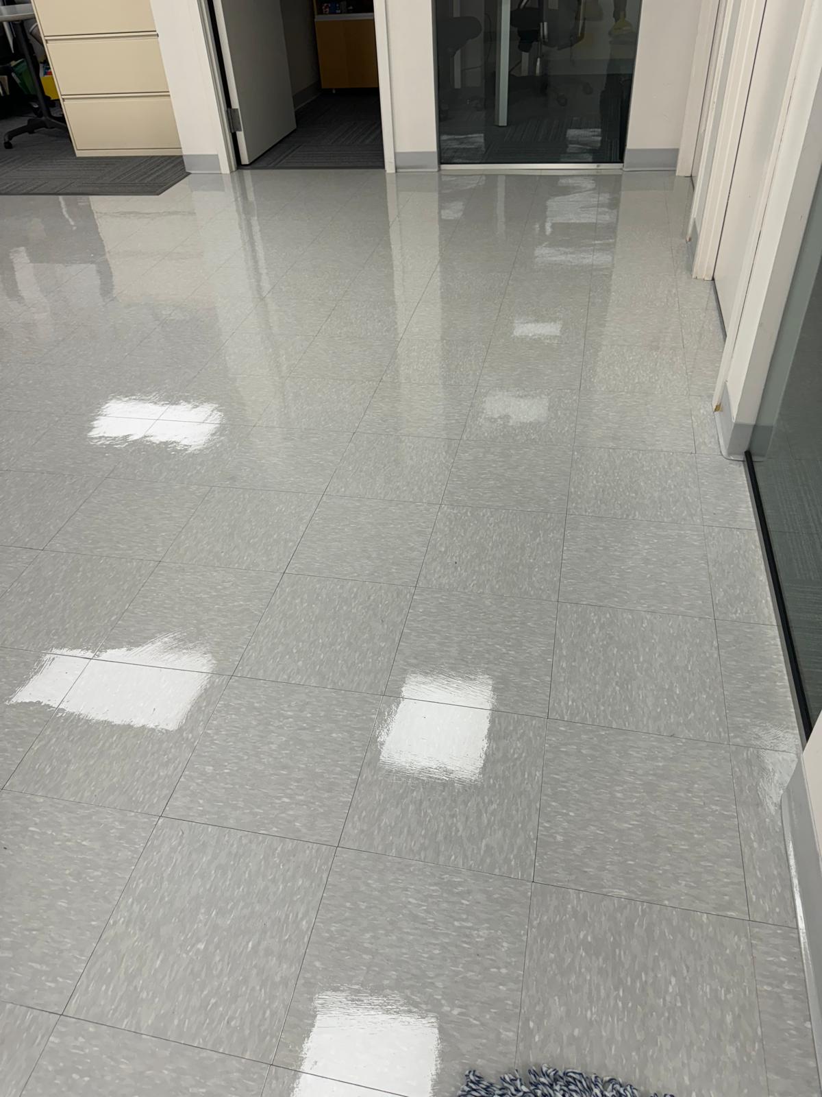 Office corridor gray VCT tile after waxing