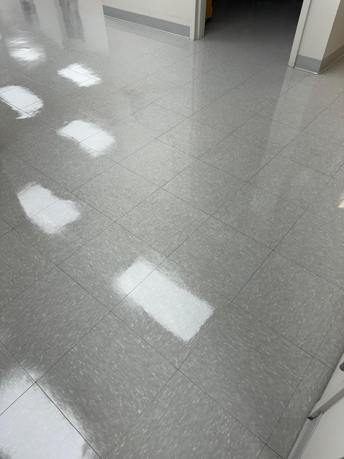 Hallway gray VCT tile after waxing