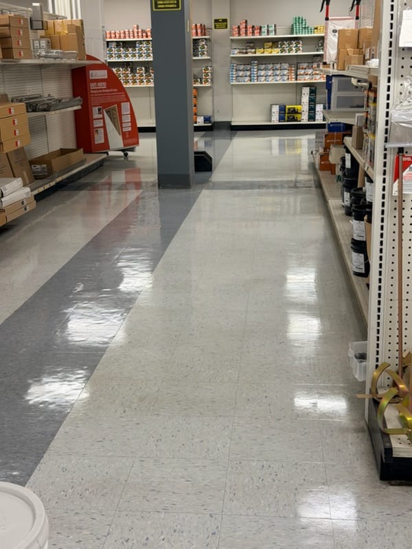 Commercial retail floor after professional restoration — polished, high-end finish