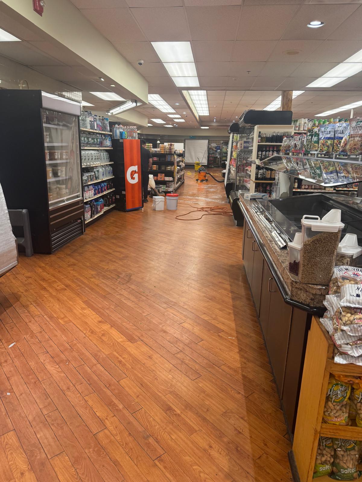 Wood plank floor before stripping and waxing